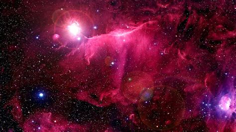 Download A Pink Nebula With Stars And Stars Wallpaper | Wallpapers.com