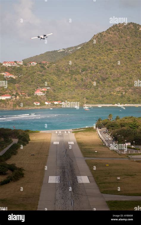 The airport and runway on the island of St. Barts in the french west ...