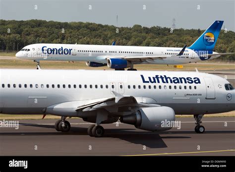 Lufthansa Airbus A330 and Condor Airways (also Lufthansa) Boeing 757, Dusseldorf airport ...