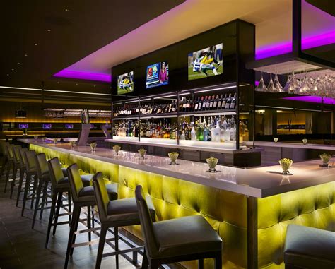 Modern Restaurant Bar Design with Yellow Chairs and Purple Lighting