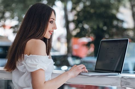 Free Photo | Young girl typing on a laptop