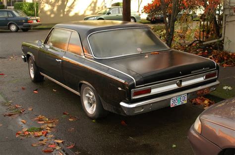 OLD PARKED CARS.: 1967 Rambler American Rogue Hardtop.