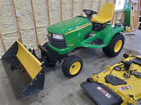 John Deere X585 4x4 Garden Tractor & Attachments - ReGreen Equipment