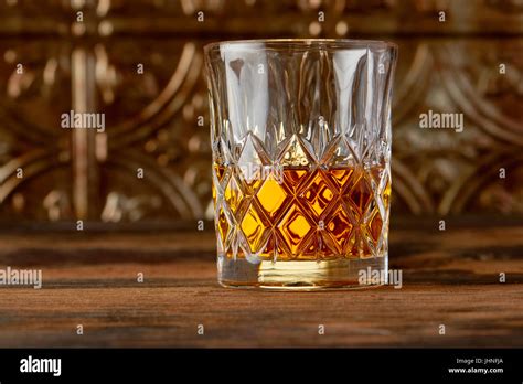 Glass of Scotch whiskey in crystal glass Stock Photo - Alamy