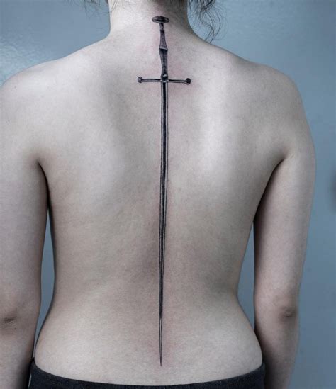 Longsword tattoo over the whole back | Sword tattoo, Sword tattoos for women, Spine tattoos for ...