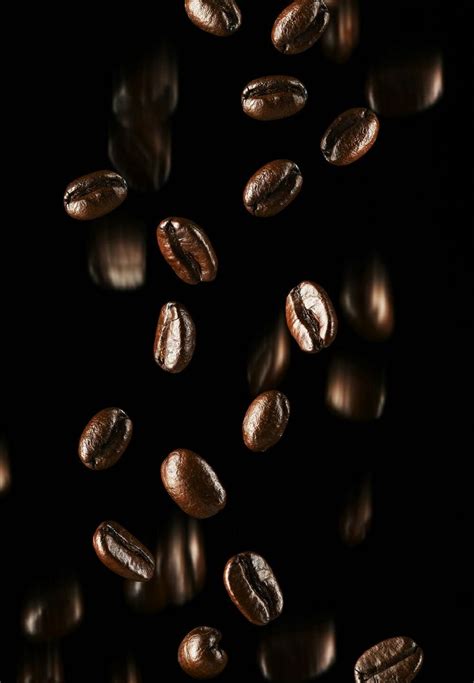 Coffee Beans Falling on Black Background