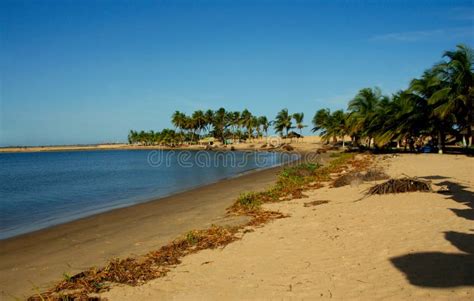 Beach at Ada Foah, Ghana stock image. Image of palm - 141364951