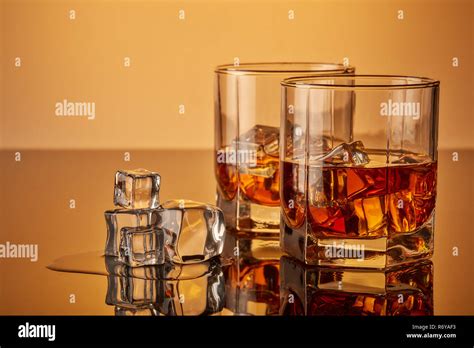 Whiskey glasses with ice Stock Photo - Alamy