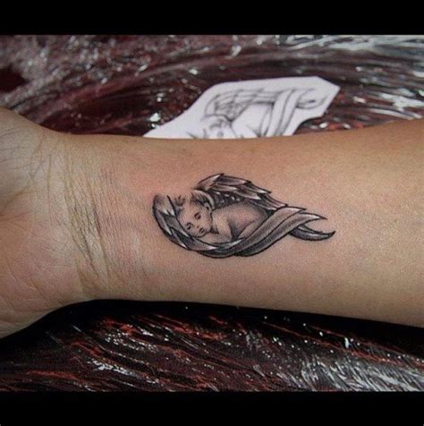 20 Angel Tattoos | Small angel tattoo, Angel tattoo for women, Baby tattoos