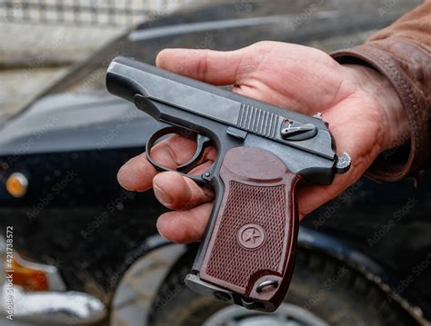 Russian semi-automatic Makarov pistol in a man's hand Stock Photo | Adobe Stock