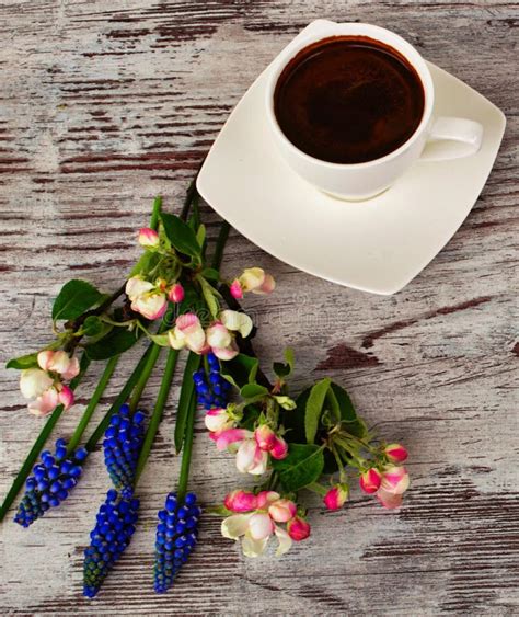 A Cup of Coffee and Beautiful Flowers. Stock Image - Image of cappuccino, grain: 91880913