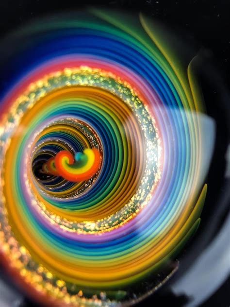 Artist Embeds Never-Ending Vortexes Into Art Glass Marbles