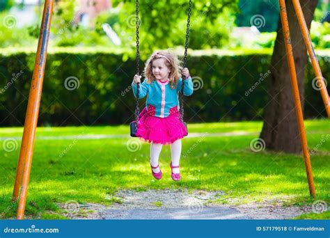 Kids On Playground Swing Stock Photo - Image: 57179518