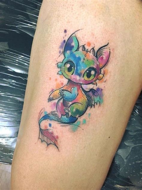 watercolor baby toothless tattoo, thigh tattoo, japanese dragon tattoo, leg leaning on blac ...