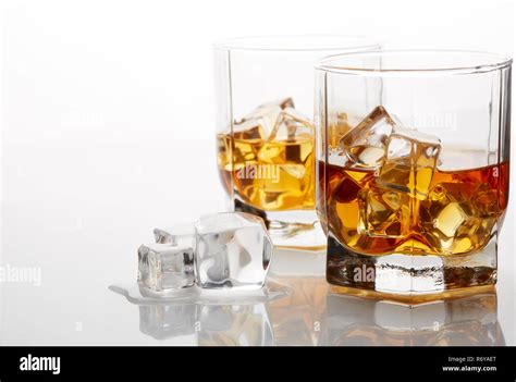 Whiskey glasses with ice Stock Photo - Alamy