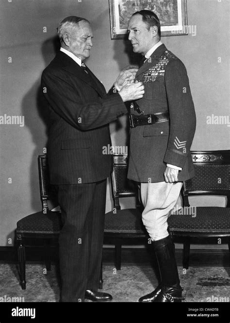 U.S. Army Officer General John J. Pershing, (1860-1948), presenting a medal to U.S. commander in ...