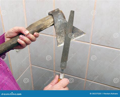 Sharpening an axe 2 stock photo. Image of hand, blade - 30237528