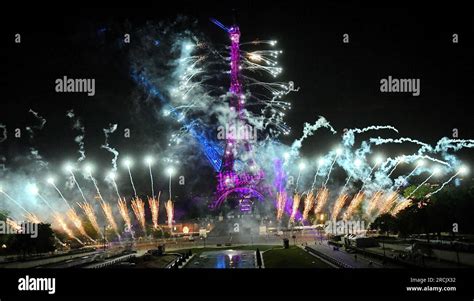 Fireworks light the Eiffel Tower during the Bastille Day celebrations ...