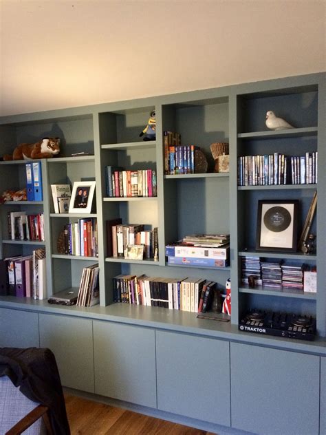 Smart stylish contemporary bookcase providing plenty of library shelving and hidd… | Shelving ...