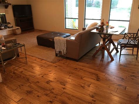 Minwax Early American stain on Pine. Solid Hardwood flooring in Kitchen - Painted by Kayla Payne