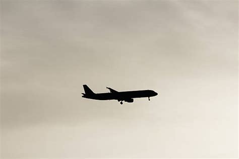 80+ Plane Silhouette Flying In Sky Behind A Vibrant Sunset Stock Photos, Pictures & Royalty-Free ...