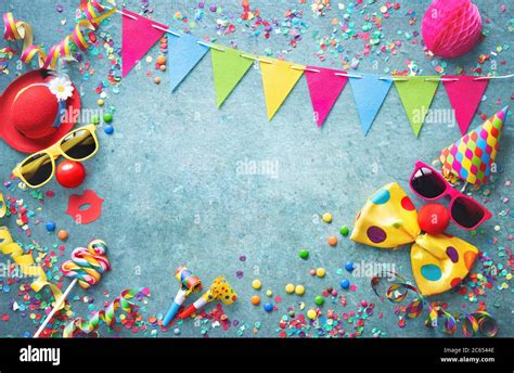 Colorful carnival or party background streamers and confetti and funny faces formed from bow tie ...