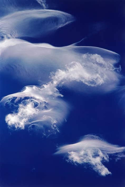 Jellyfish Clouds Photograph by Robert VanDerWal