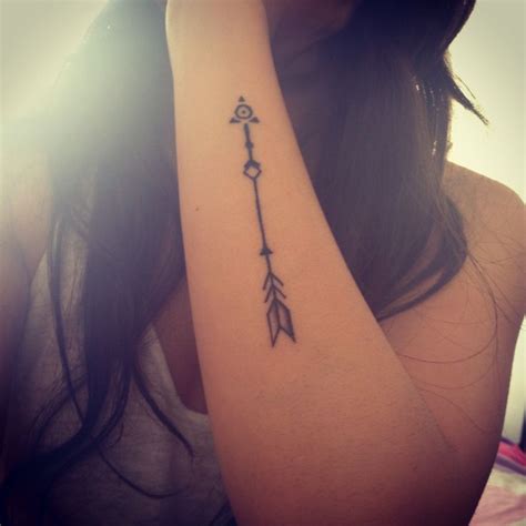 Girls hand arrow tattoo