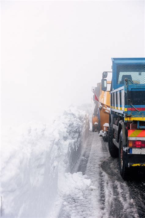 "A Snow Plow Tractor Clearing The Snow On The Roads From A Winter Storm" by Stocksy Contributor ...