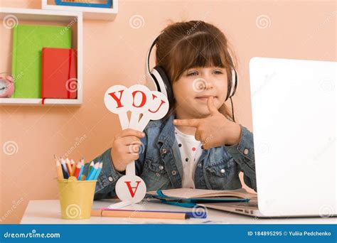 Learn English Concept with Kids, Girl Using Her Laptop. Kid Using ...