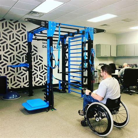 Physical Therapy clinic with MoveStrong Nova-4 Functional Training Station. Wheelchair ...