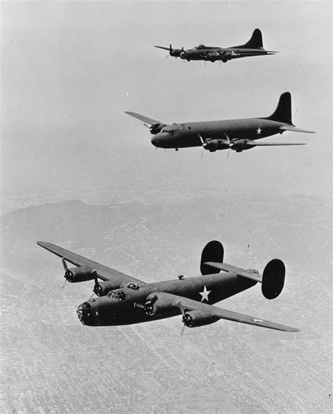 three airplanes flying in the sky over a city