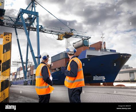 Port Workers With Ship Being Loaded Stock Photo, Royalty Free Image: 26323571 - Alamy