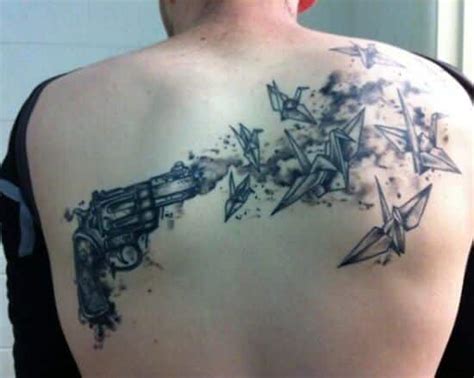 Lower Back Gun Tattoos