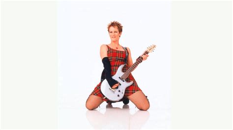 Download Freaky Friday Jamie Lee Curtis Playing Guitar Wallpaper | Wallpapers.com