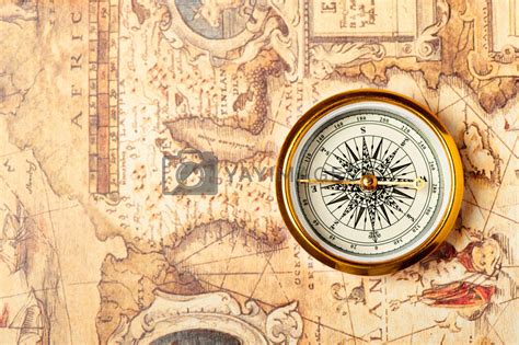 Old compass on ancient map by galdzer Vectors & Illustrations with ...