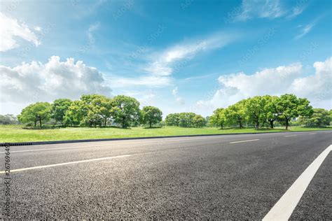 Country road and green forest natural landscape under the blue sky Stock Photo | Adobe Stock