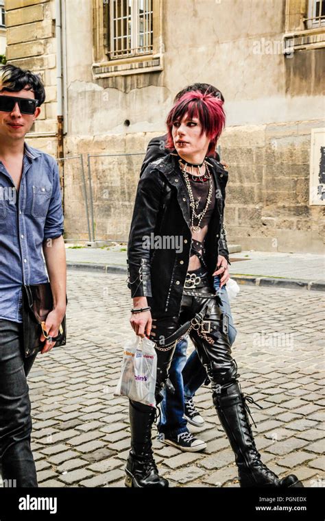 Three teenage boys into Goth and punk styling and fashion seen walking ...