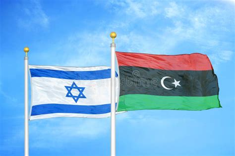 Israel And Libya Two Flags On Flagpoles And Blue Cloudy Sky Stock Photo - Image of conflict ...