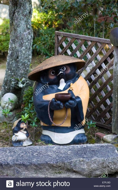 Tanuki (Japanese raccoon dog) statue at Daisho-in temple on Mount Misen, on the island of ...