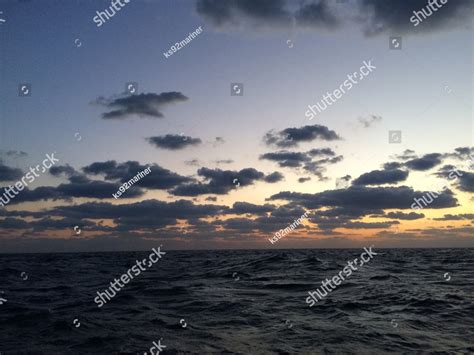 Ocean water sunset sunrise HD wallpaper, dark blue ocean with grey clouds and golden sky ...