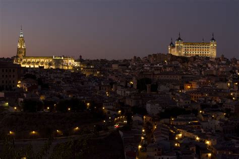 Toledo, Spain - Night is falling. The the Cathedral and the Alcazar do ...