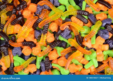 Halloween Gummy Worms Witches Brooms Cats Candy Stock Image - Image of confectionery, macro ...