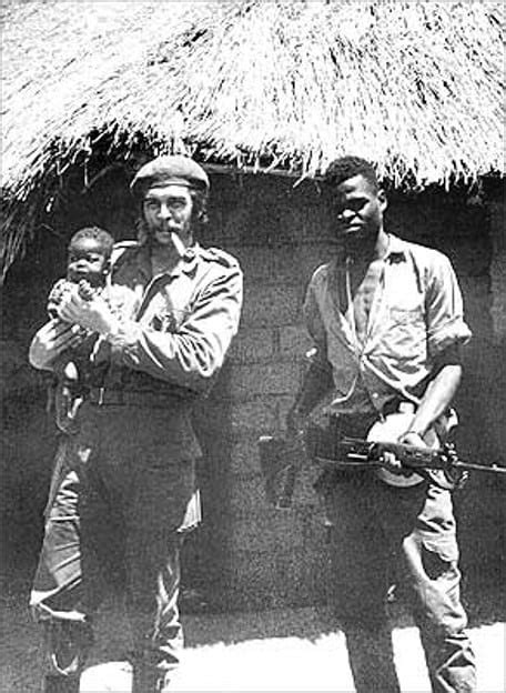 Che Guevara holding a Congolese baby and standing with a fellow Afro-Cuban soldier in the Congo ...