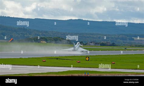 Eurofighter Typhoon FRG4 taking off from wet runway RAF Lossiemouth ...