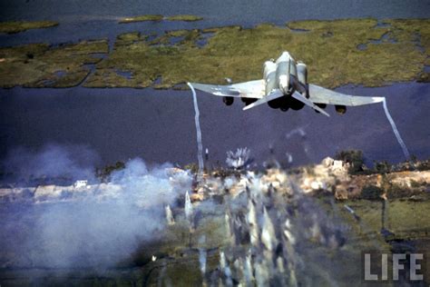 USAF F-4 Phantom completing a gun-run in Vietnam, LIFE Magazine, 1960s : aviation