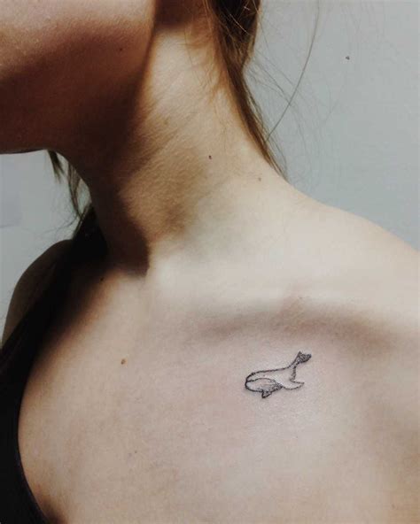 Small whale tattoo on the clavicle - Tattoogrid.net