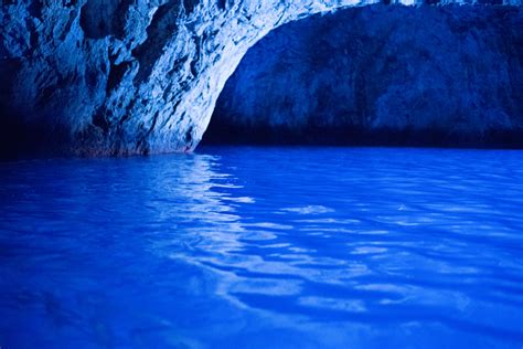 Inside the unique Blue Grotto cave at Capri Italy - Pure Vacations