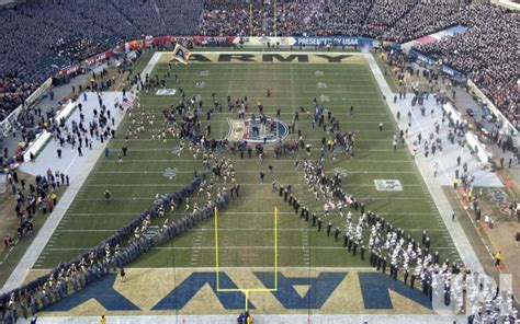 Photo: Army and Navy football plays take the field for the Army Navy game. - PHI2010121112 - UPI.com