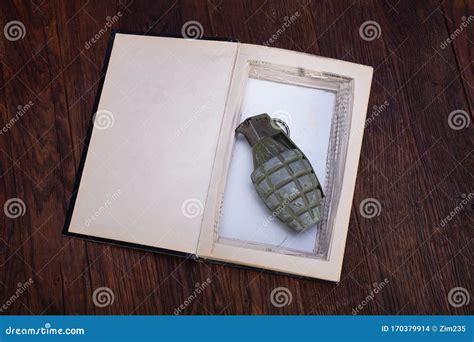 Hand Grenade Hidden in a Book Stock Photo - Image of bullet, blast: 170379914